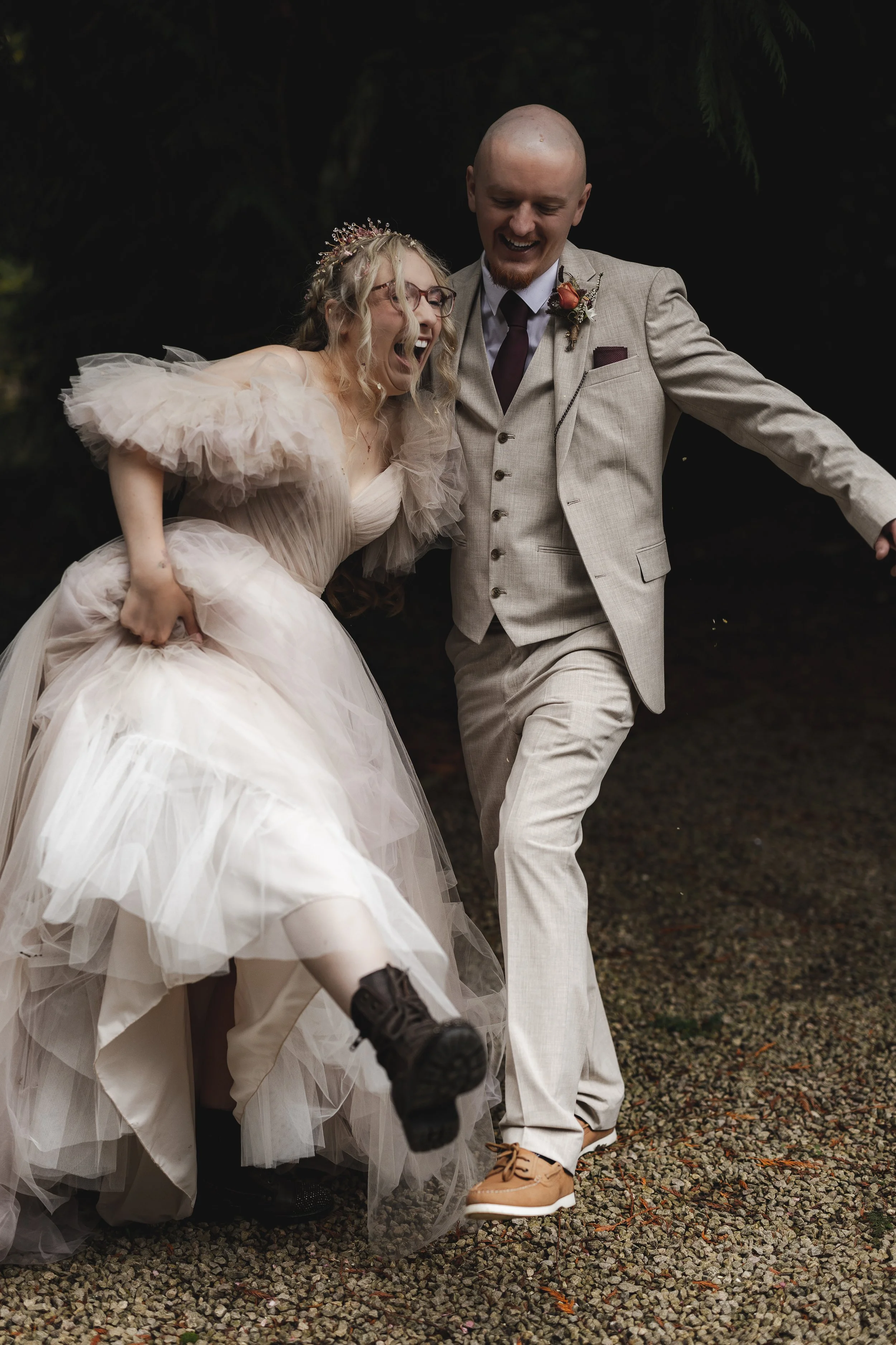 newly-married-couple-showing-off-their-wedding-shoes.jpg