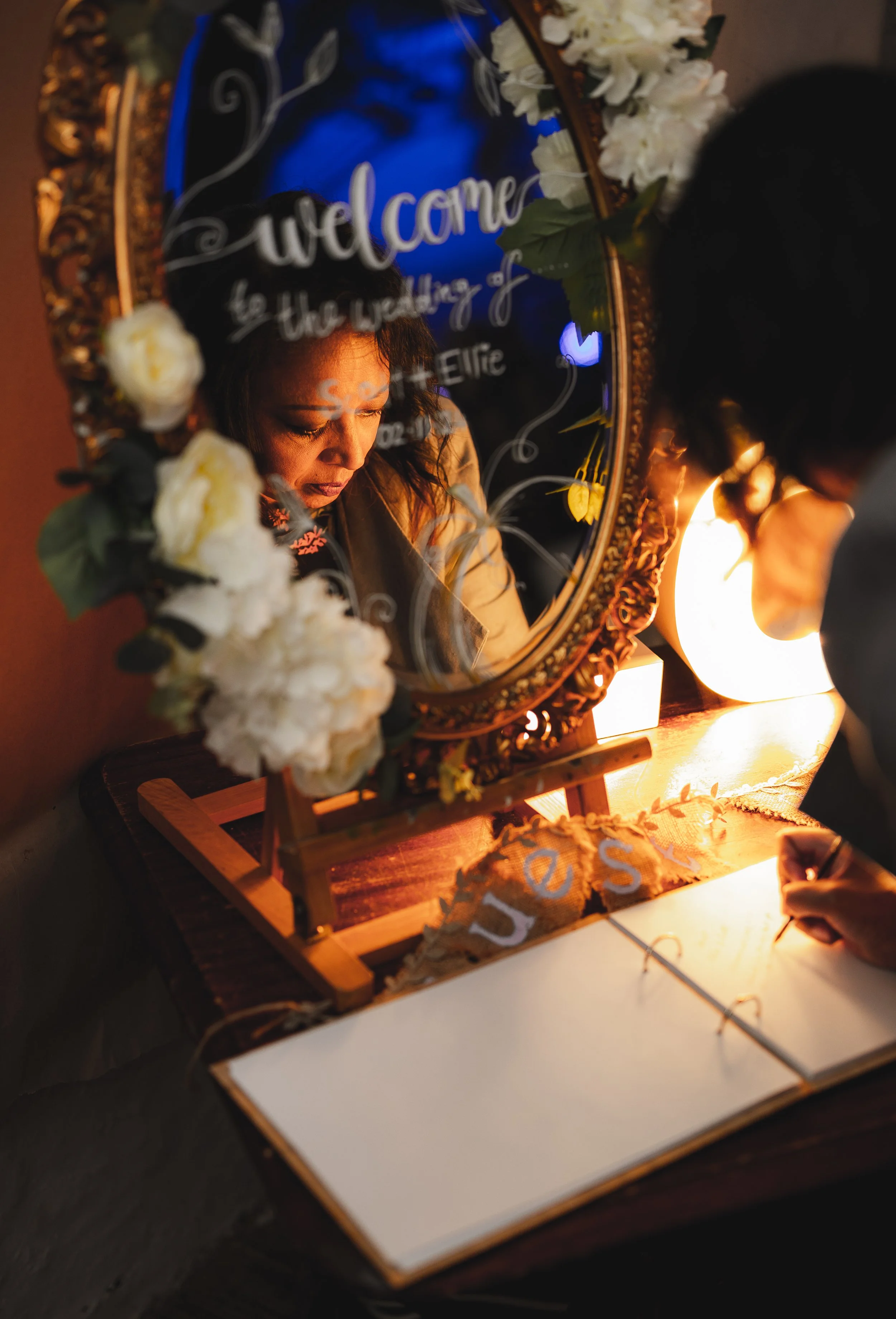 leicestershire-wedding-guests-writing-in-the-guestbook.jpg