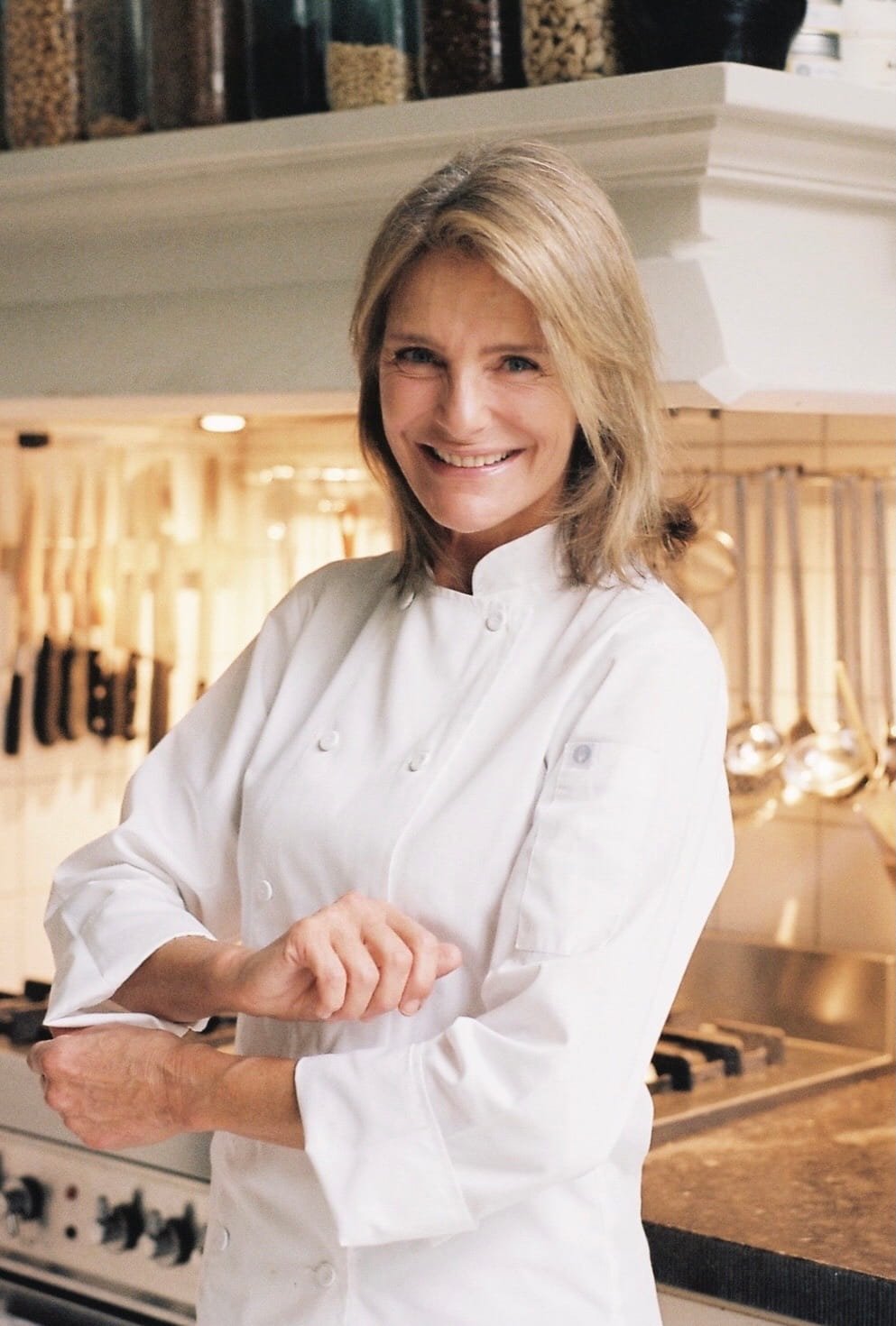 Portrait of Chef Adrienne in her kitchen, reflecting her personal approach to cooking and hosting in Amsterdam.