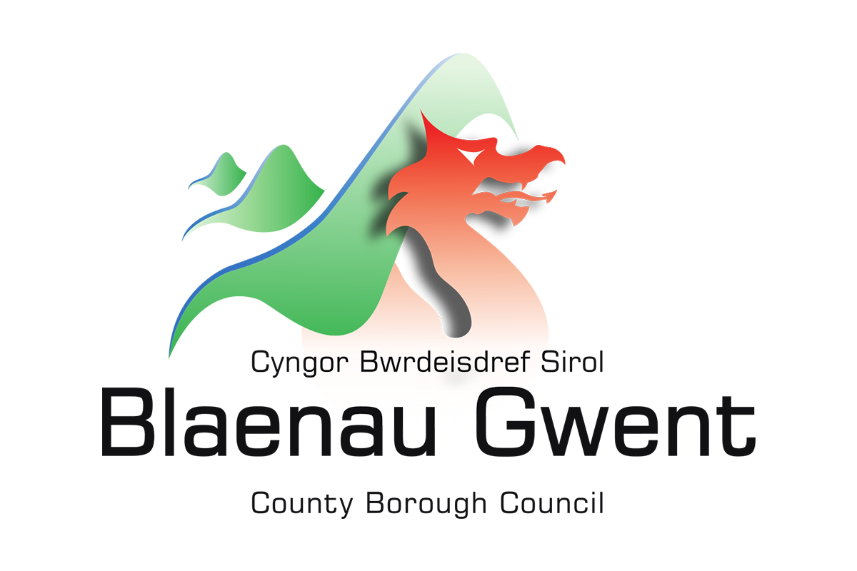 Logo featuring a mountain with a red and black wolf head in front of it, and green text underneath.