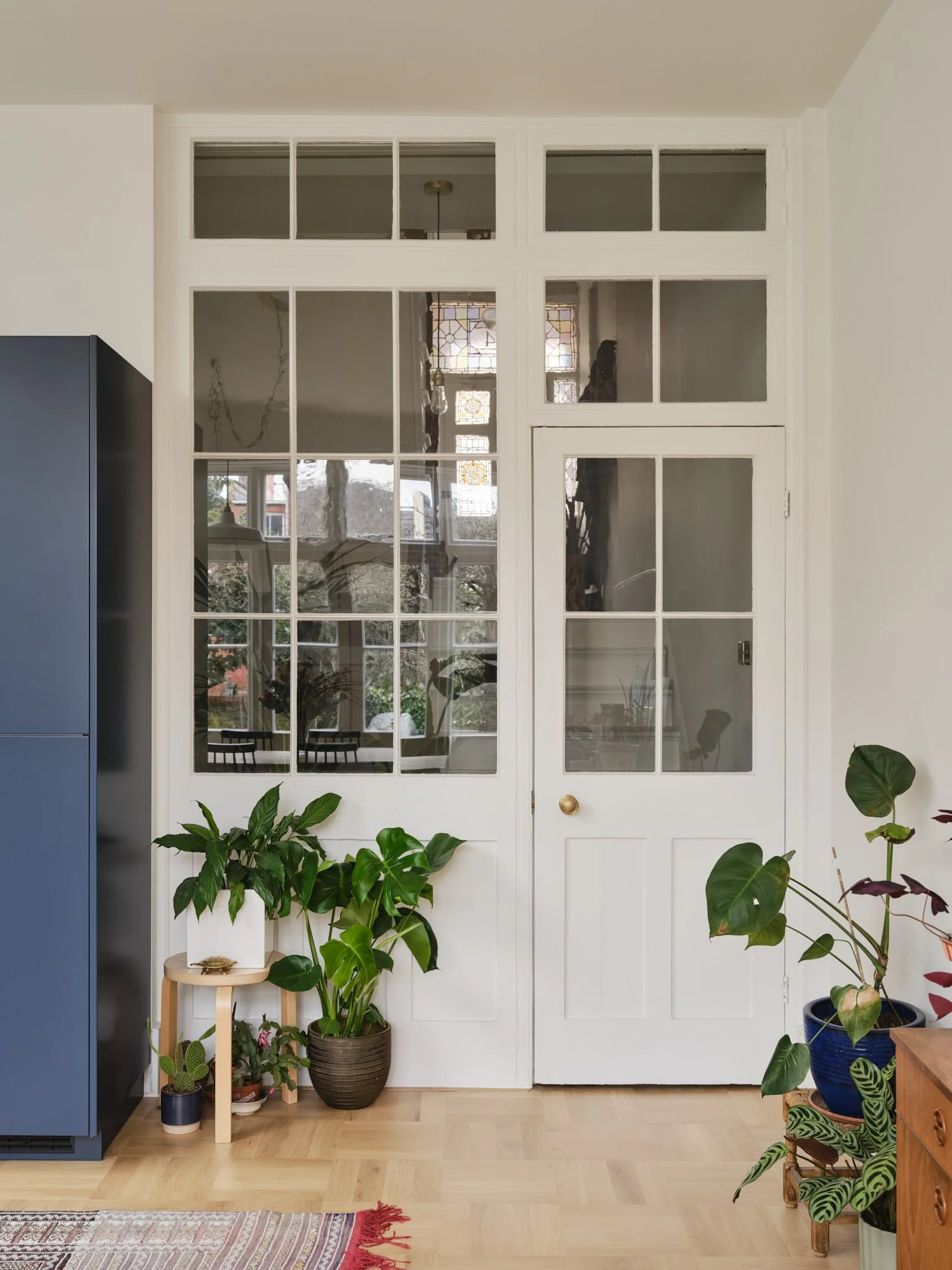 Re-used original internal door and screen bring light into the heart of the home