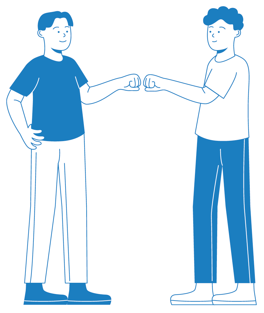 Two young men standing facing each other, engaging in a fist bump with their arms extended.