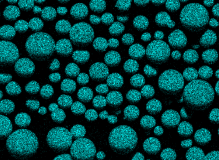 Microscopic view of numerous blue-green spherical particles grouped together on a black background.