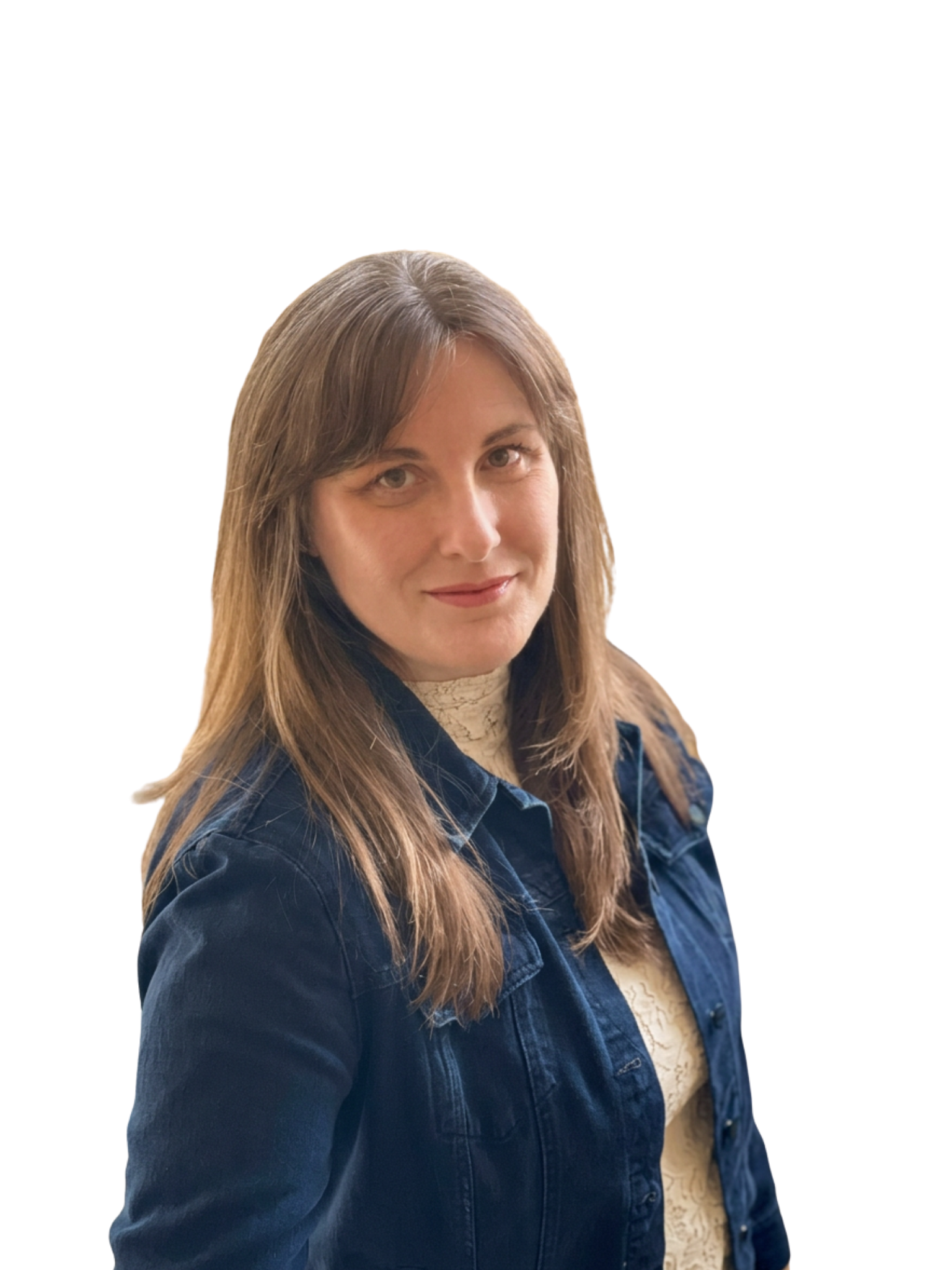 Portrait of a woman with long brown hair, wearing a blue denim jacket over a beige patterned top, smiling slightly.