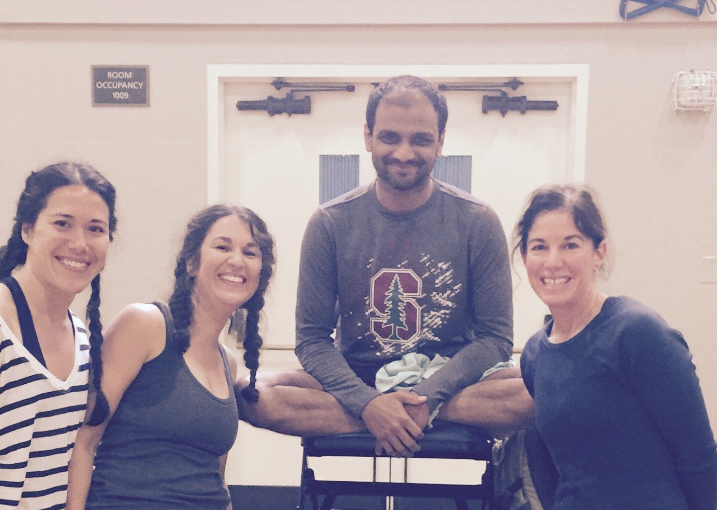 Marsha McNeight posing with Sharath Jois and three other women at the Sharath Yoga Center in Mysore, India.