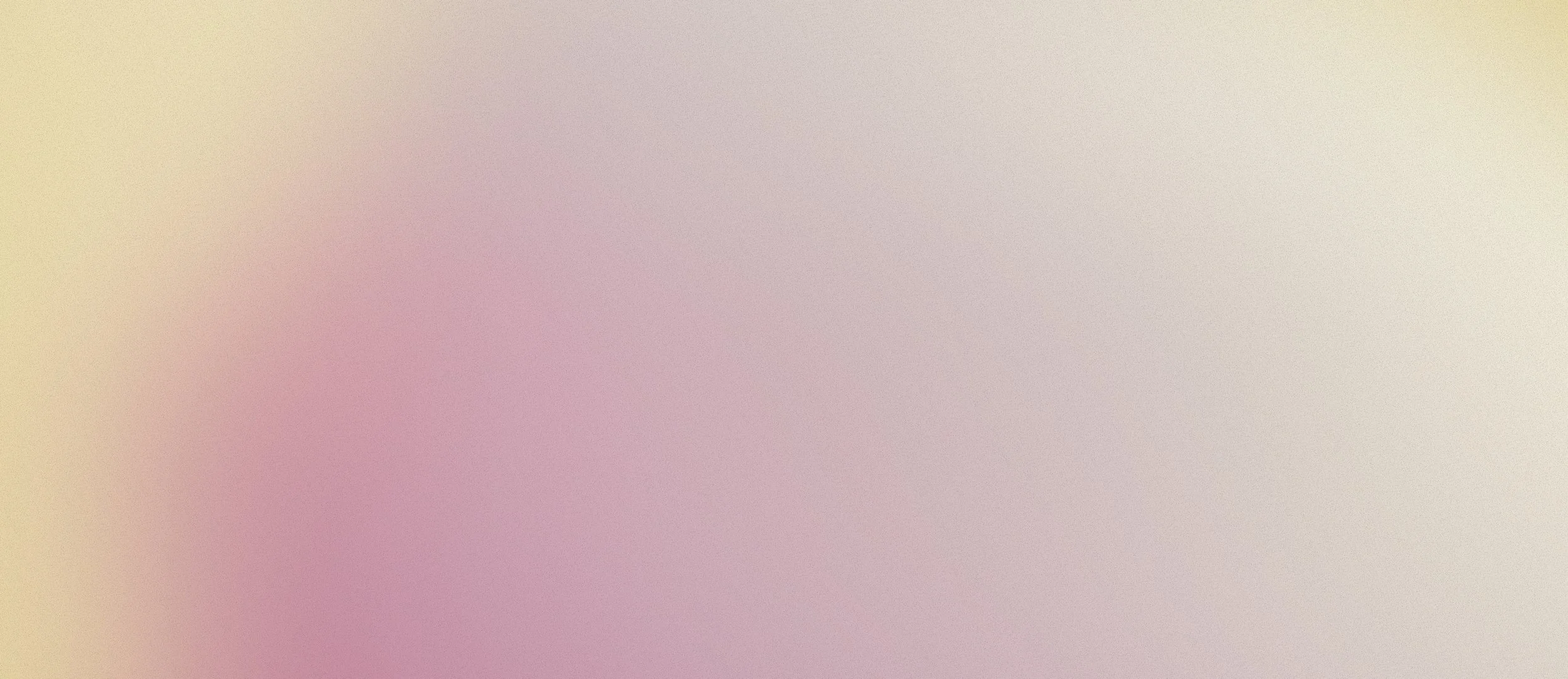 A blurred background with pastel tones of pink, cream, and light purple