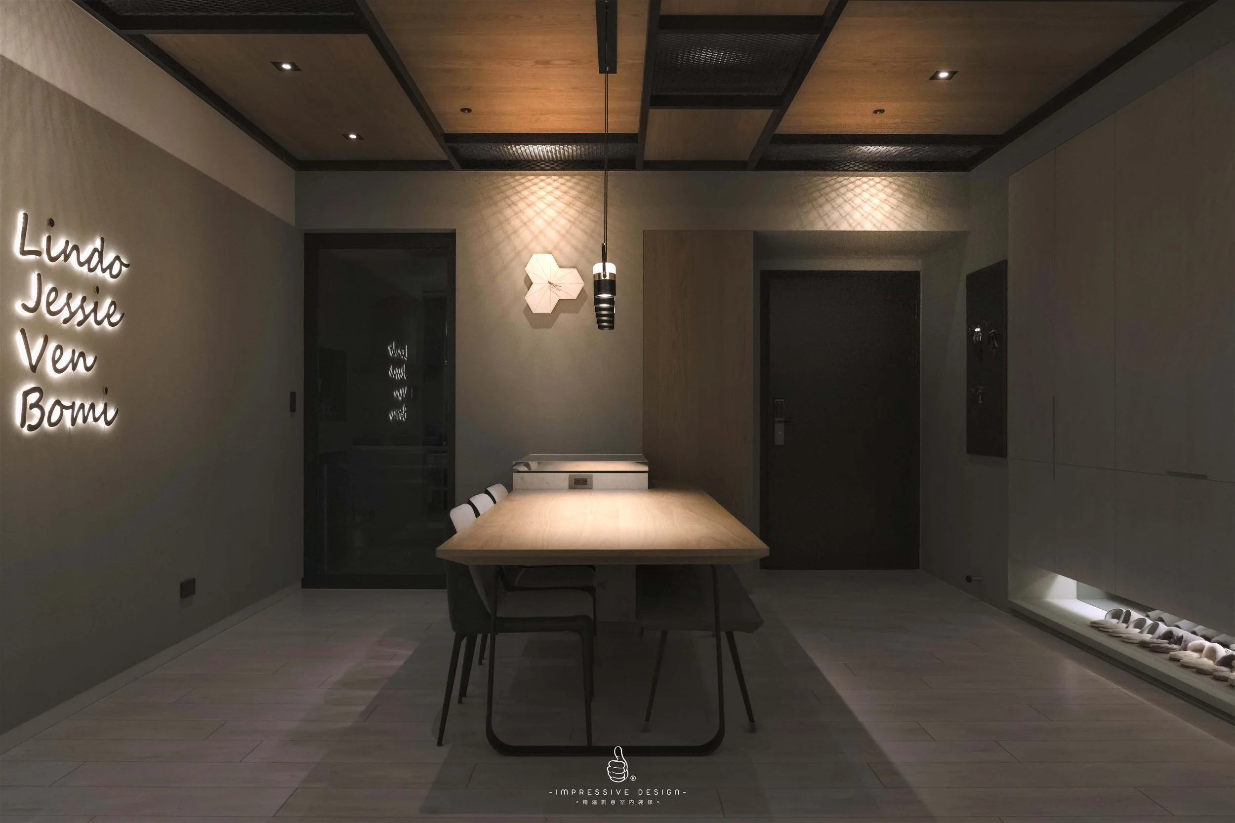 Minimalist dining room with a wooden table, four chairs, and decorative wall accents, illuminated by subtle lighting.