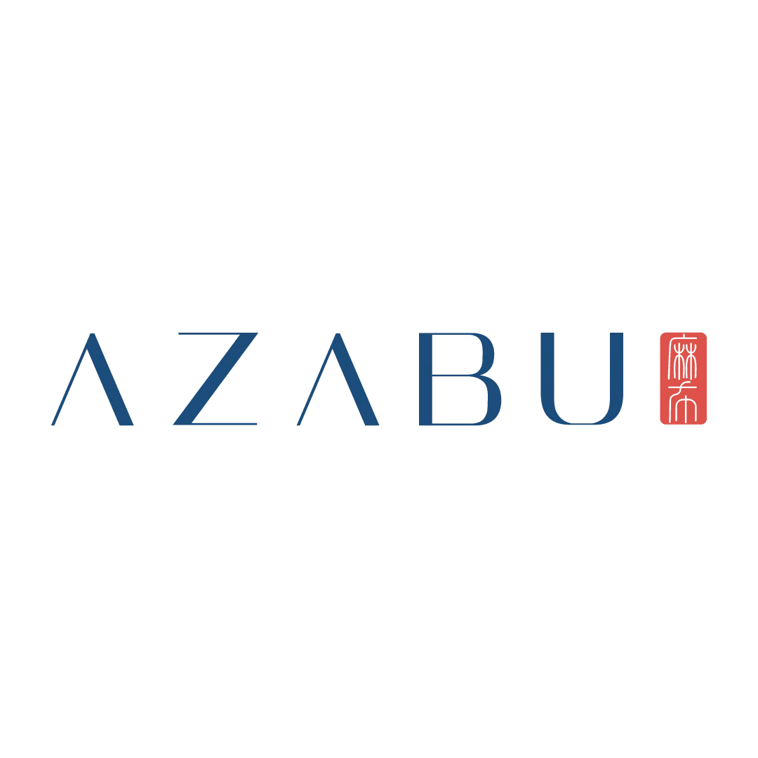 Logo for Azabu with black Japanese characters above the word 'AZABU' in blue and a red Japanese seal to the right.