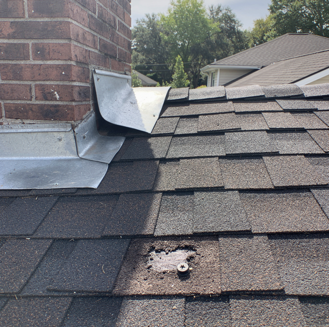 chimney flashing separated from brick roof shingles