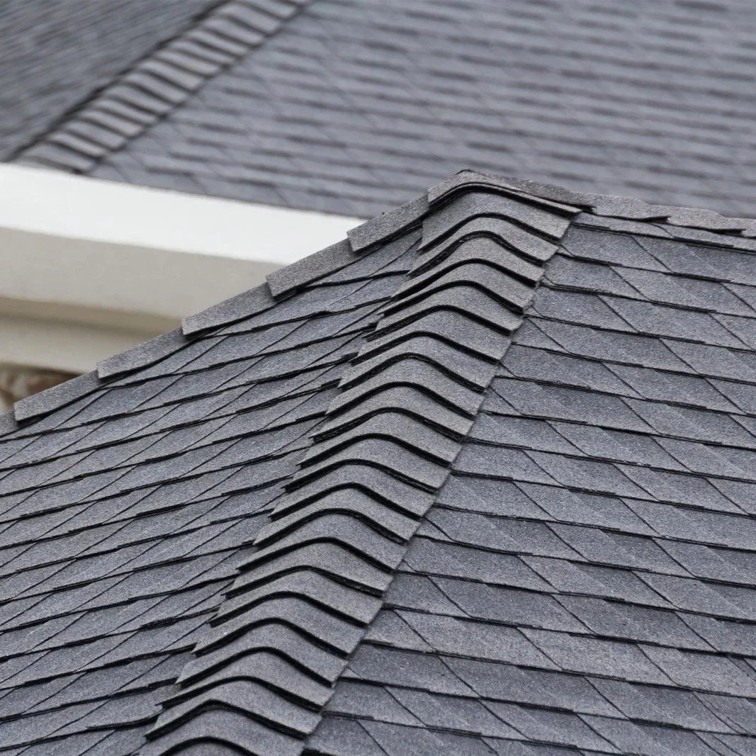 Close-up of architectural shingle roofing system with ridge caps designed for durability, wind resistance, and Louisiana weather protection performance.