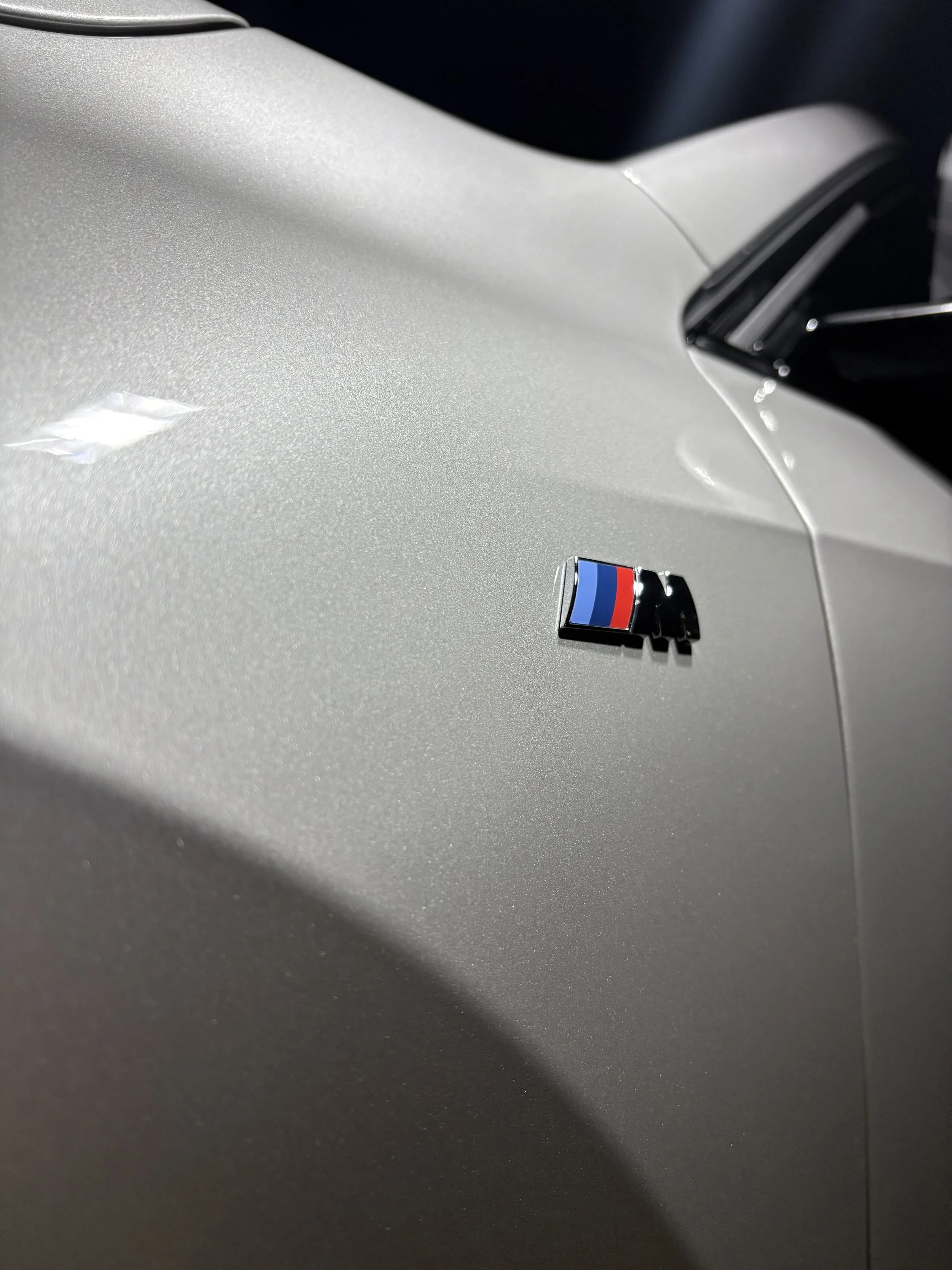 A polished BMW X1 with close up focus on the M sport moniker