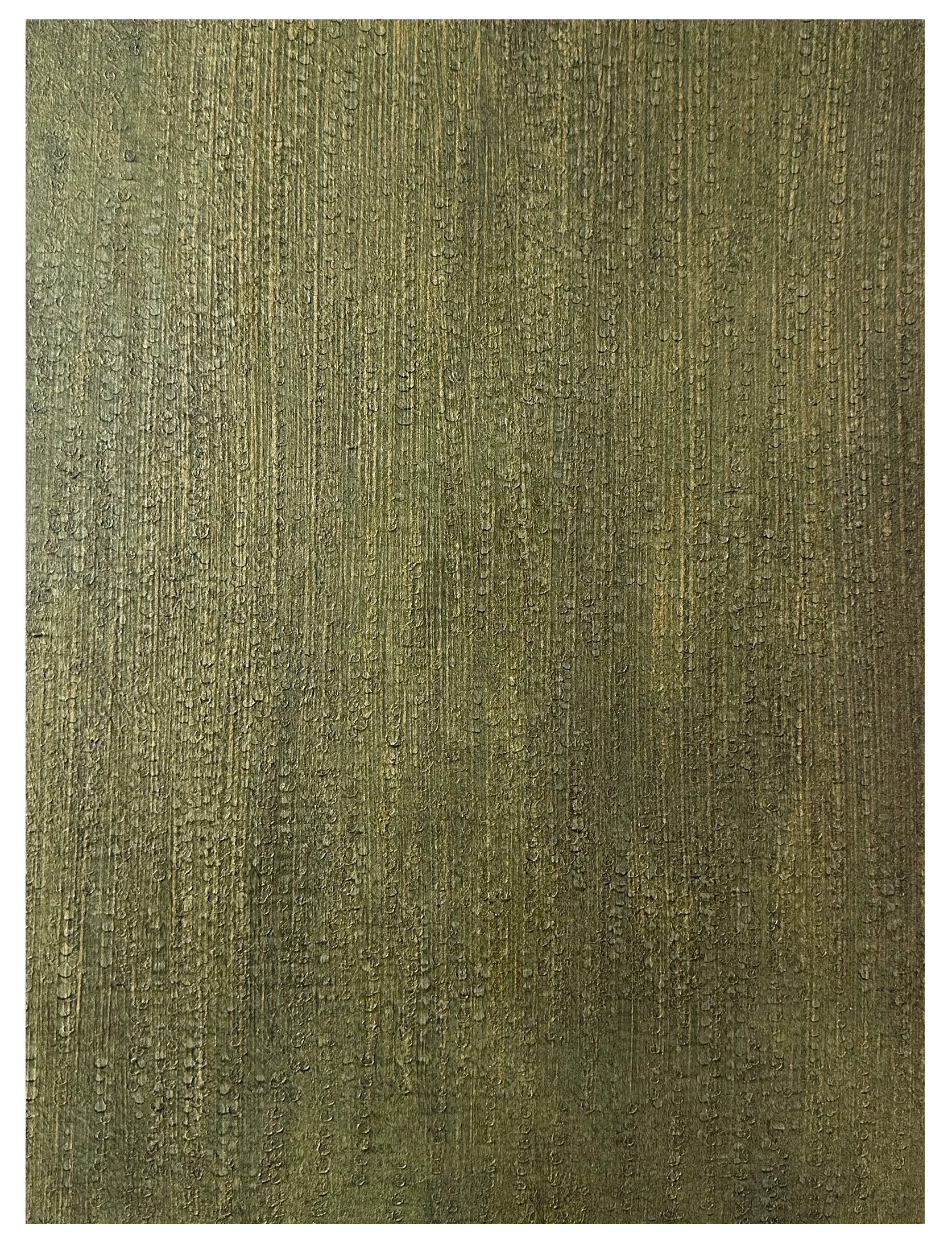 Close-up of a wooden surface with visible grain and water droplets on it.