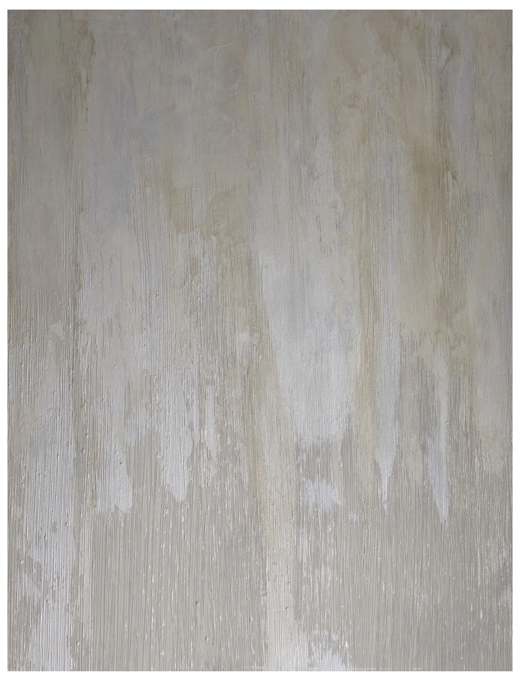 Close-up of a textured wall with peeling beige and white paint.