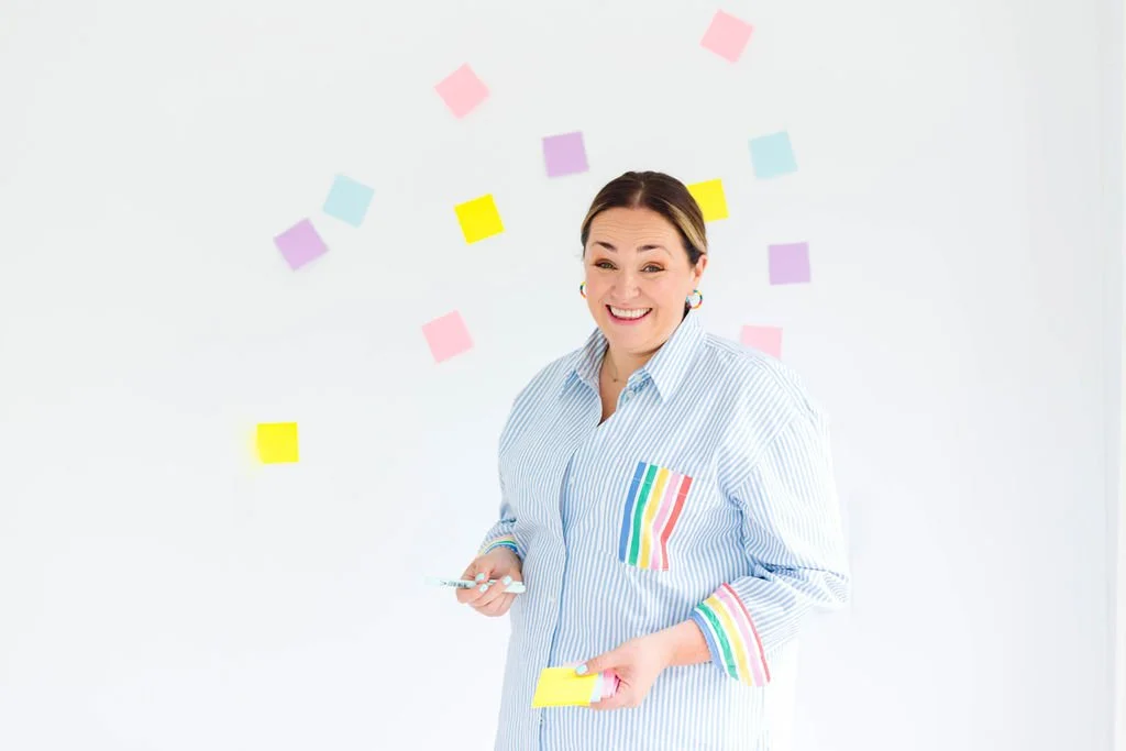 Corporate Coaching. Change Management. New offsite ideas. Team development. Corporate Events. Boost your engagement. Team building activities. Engaging facilitator with post-its and bright clothes, reminding you to avoid perfection