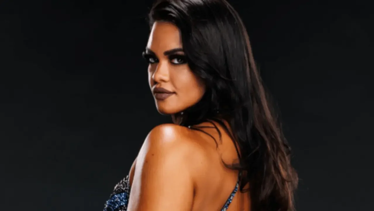 Professional wrestler Nikki Martinez (formerly Nikki Blackheart) looking over her shoulder with an intense gaze in an official WWE NXT studio portrait against a black background.