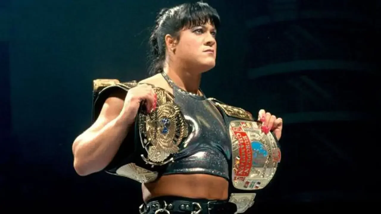Chyna holding championship belts during her iconic WWE Attitude Era run.