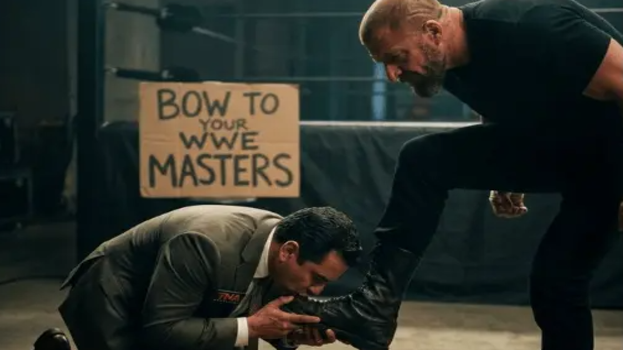 Carlos Silva Kisses Triple H’s Boot… And TNA Fans Are NOT Holding Back