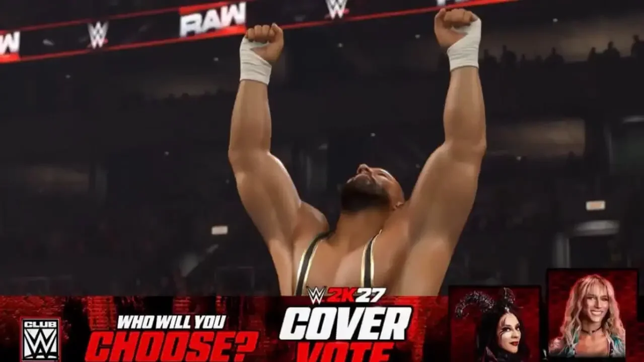 A promotional screen from a WWE video game featuring WWE superstar Bron Breakker with both arms raised in victory inside an arena.