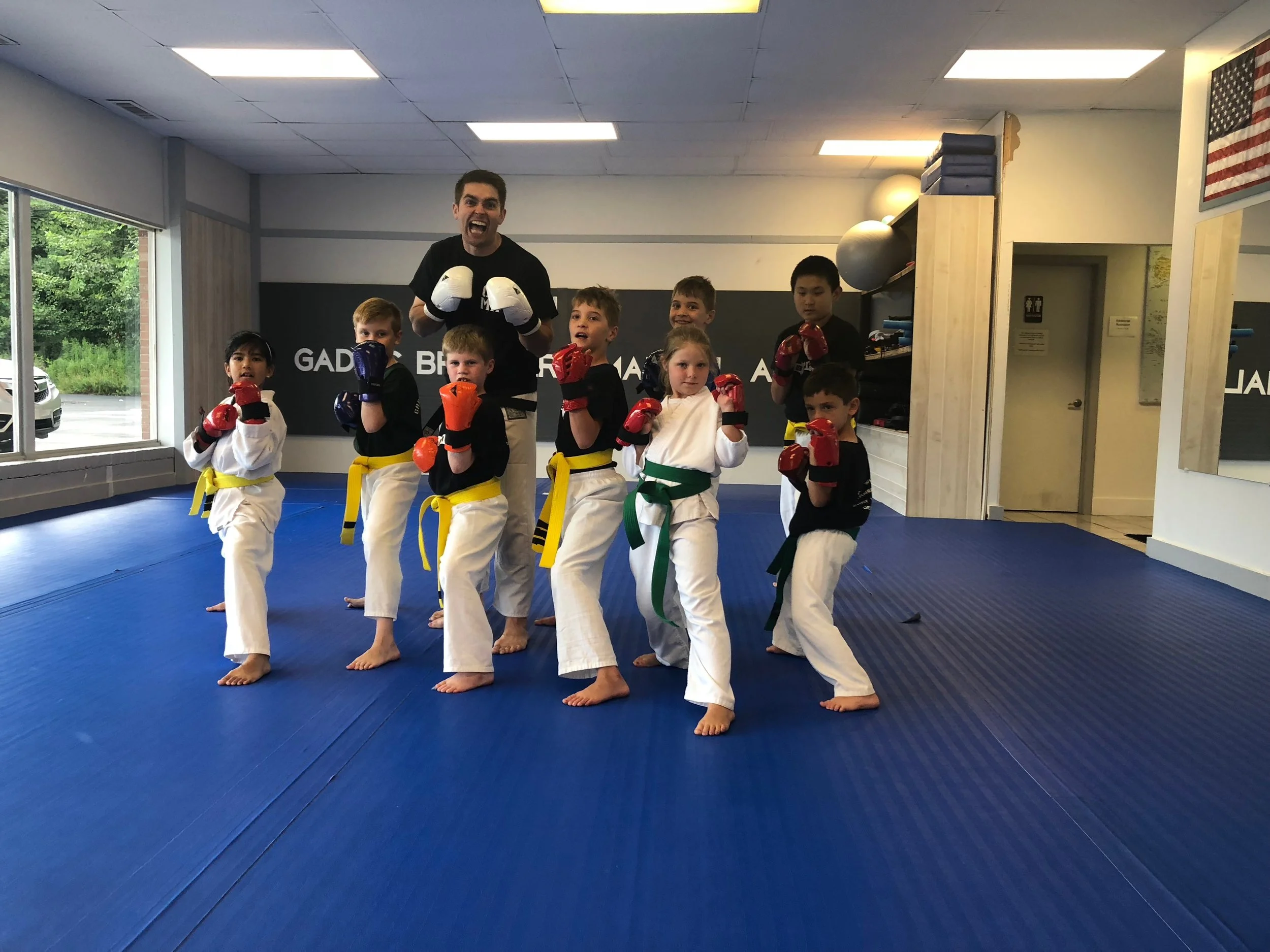  A sweaty class of youth kumite (sparring). 