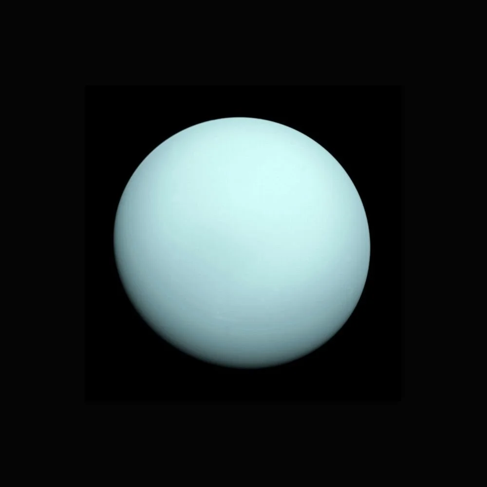 Uranus Opposition. An Image of a large, glowing, light blue sphere planet against a black background.