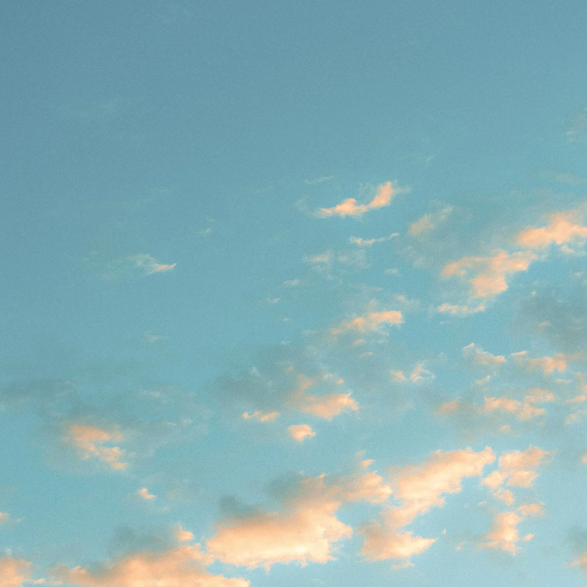 Sky with scattered clouds during sunset or sunrise.
