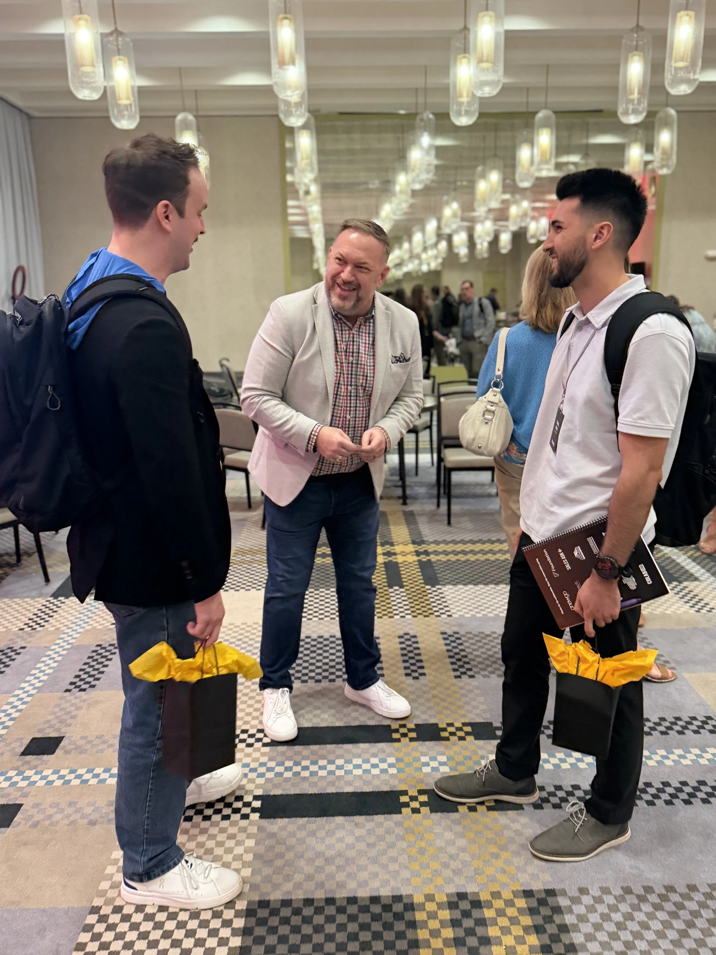 CoLab Live facilitator connecting with attendees after homebuilding sales leadership workshop session