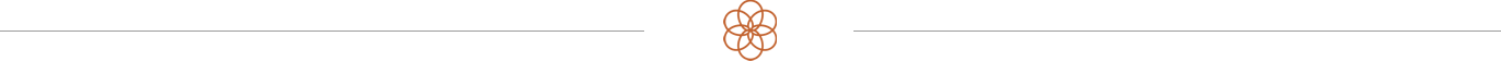 A blurred black background with an orange geometric shape at the top center.