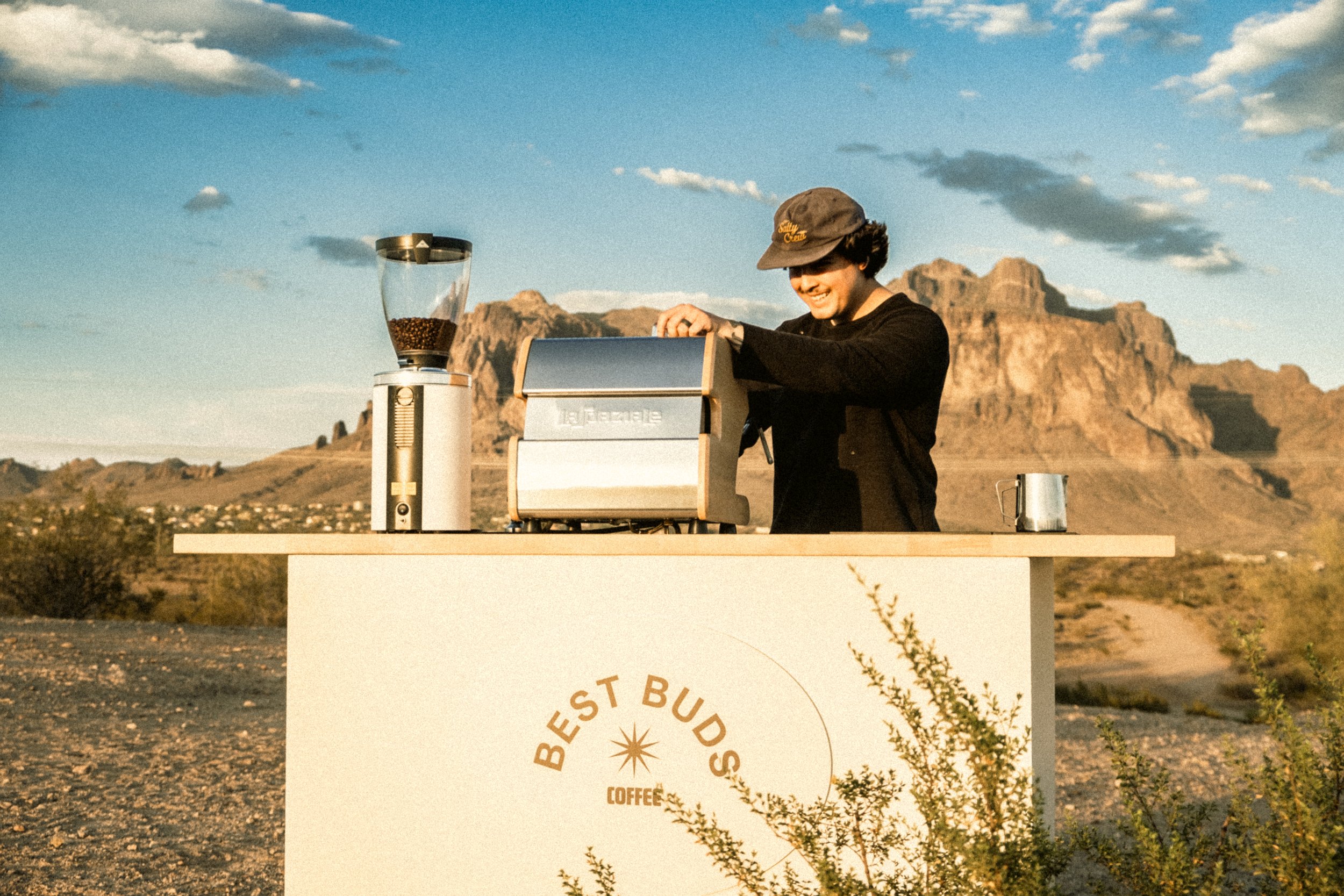Coffee cart barista serving coffee at AZ private event.