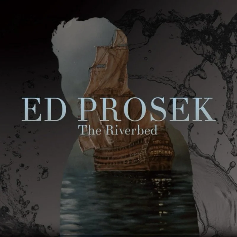 A ship with old wooden sails on water, promoting Ed Prosek's art collection titled "The Riverbed."