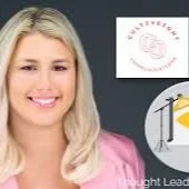 A young woman with long blonde hair smiling in front of a dark background with a logo and a sign that has a yellow pencil and a tree.