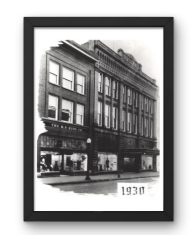 Black and white photograph of a multi-story brick building with large windows, labeled 'The R.P. Kauffman' on the ground floor, with the date 1930 at the bottom.