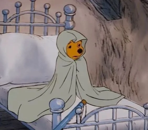 Person sitting with lingering thoughts after a vivid, emotional dream