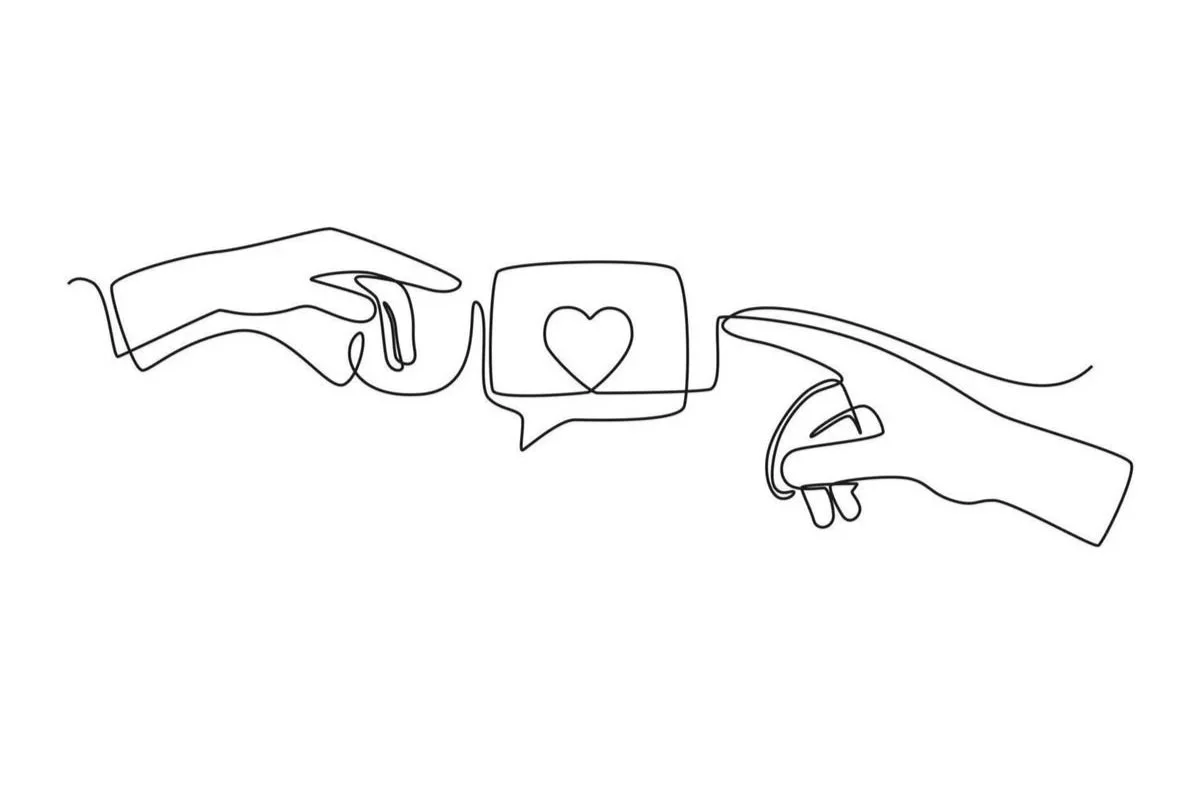 Photo of hands touching, symbolizing connection and attachment in therapy, illustrating emotional bonding and relational support.