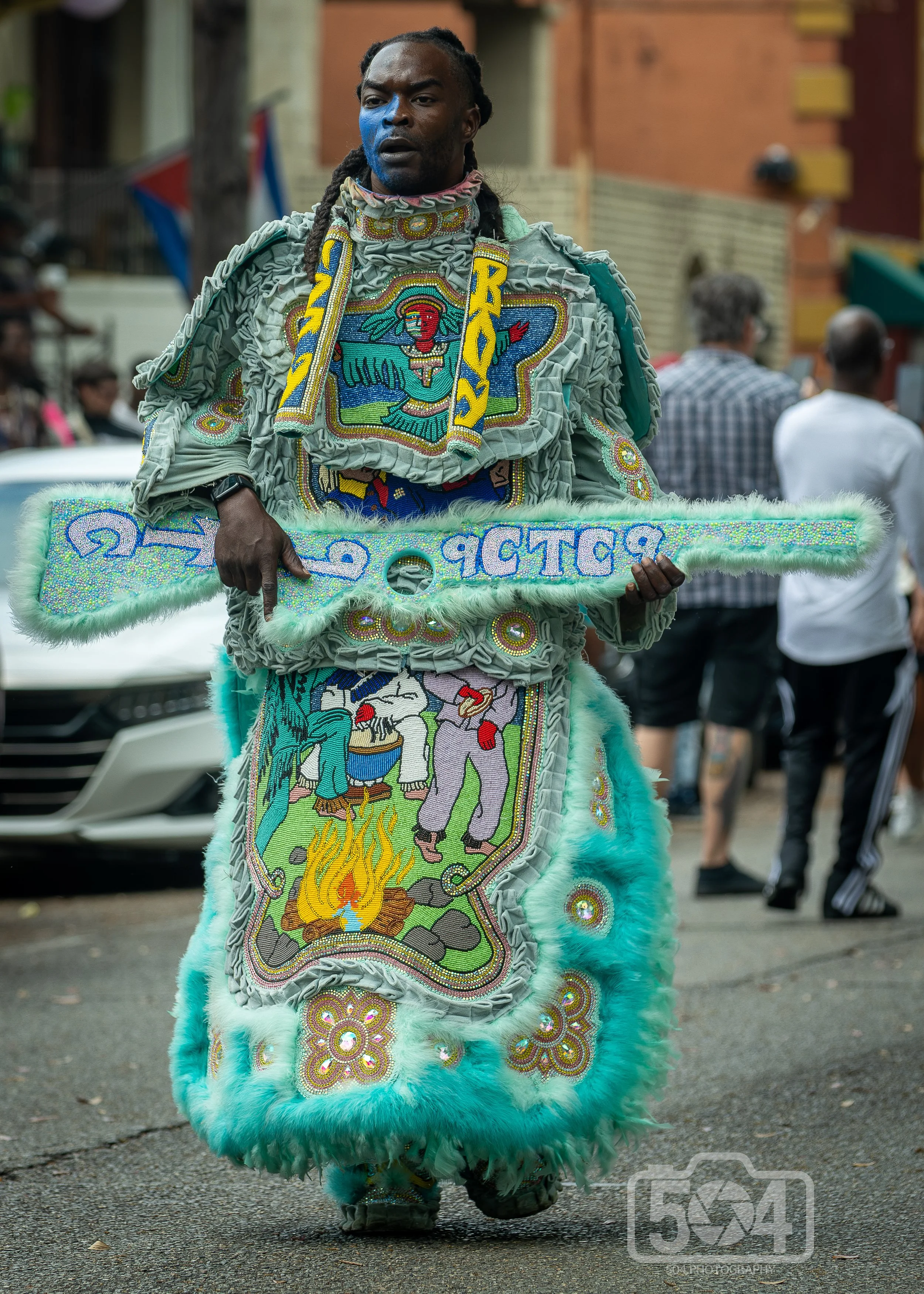 flagboy in teal with rifle.jpg