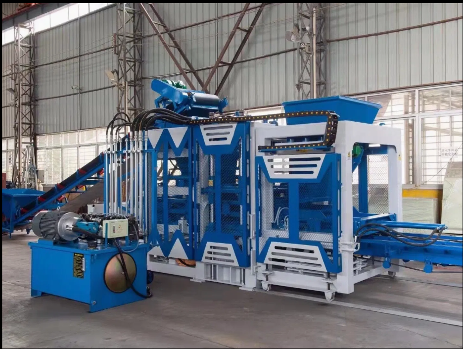 Large industrial machine inside a warehouse with metal framework, designed for manufacturing or processing, painted blue and white with various sections and moving parts.