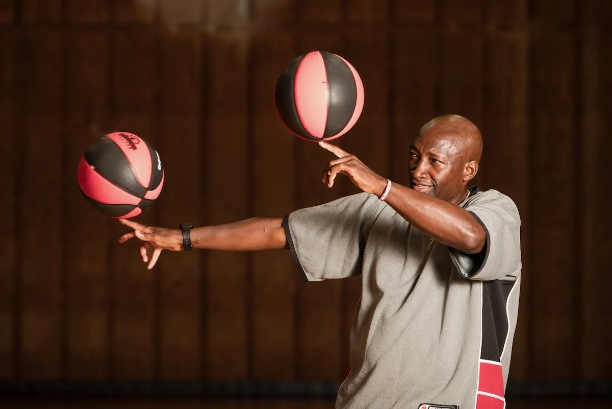Inspirational speaker Dexter Williams spinning basketballs