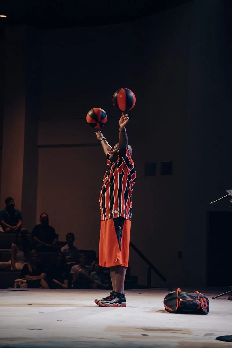 Inspirational presenter Dexter Williams performing on a church stage