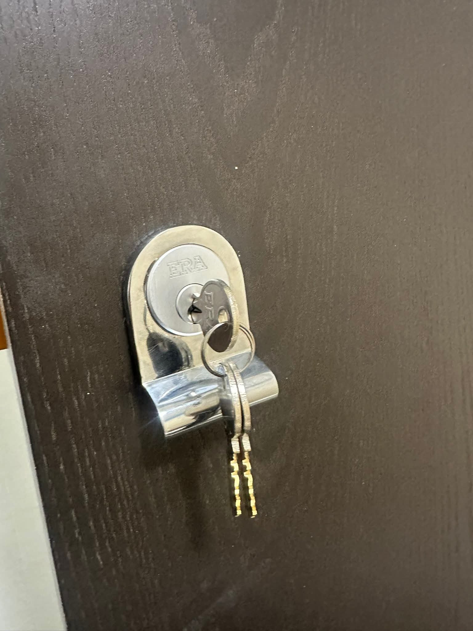 New Actra rim night latch installed on a wooden front door in Kensington.