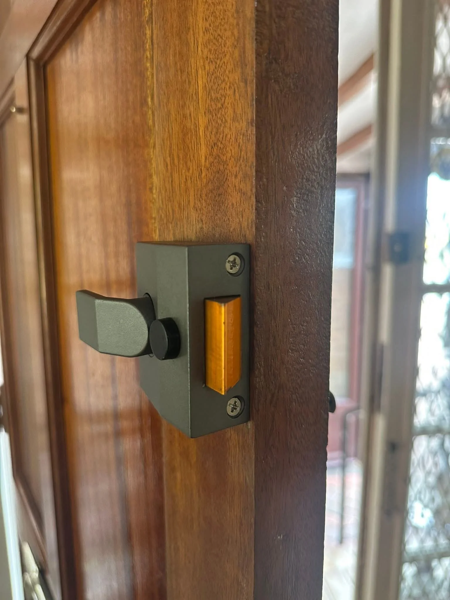 Actra rim night latch lock installed on a front door by Kensington Lock & Key in Kensington.