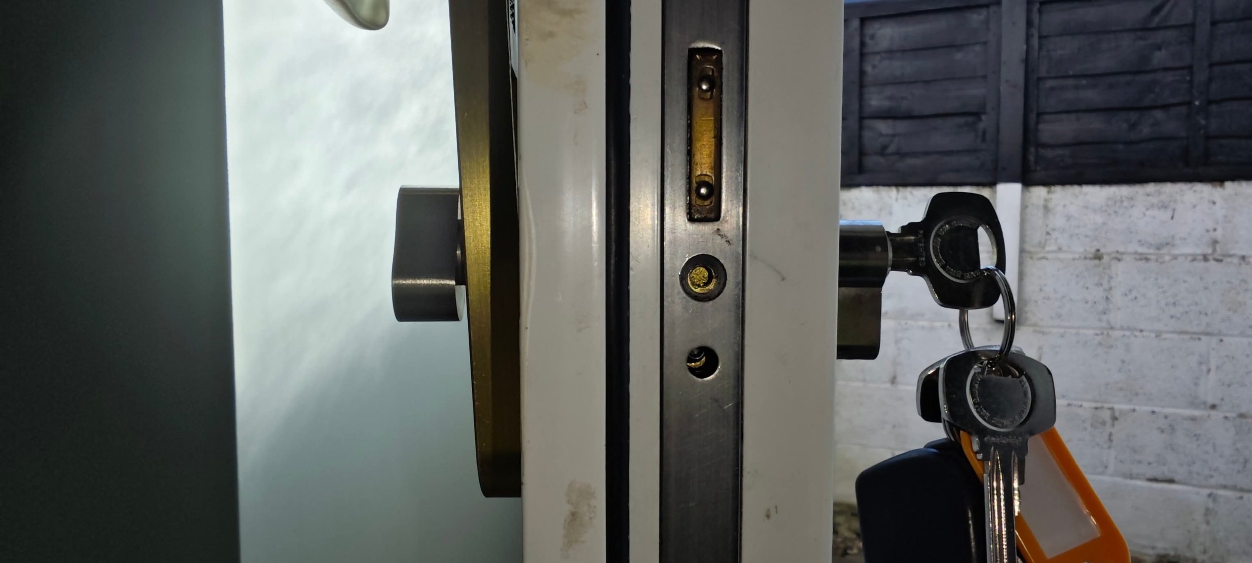 Close-up of a repaired Yale uPVC door locking mechanism by Kensington Lock & Key.