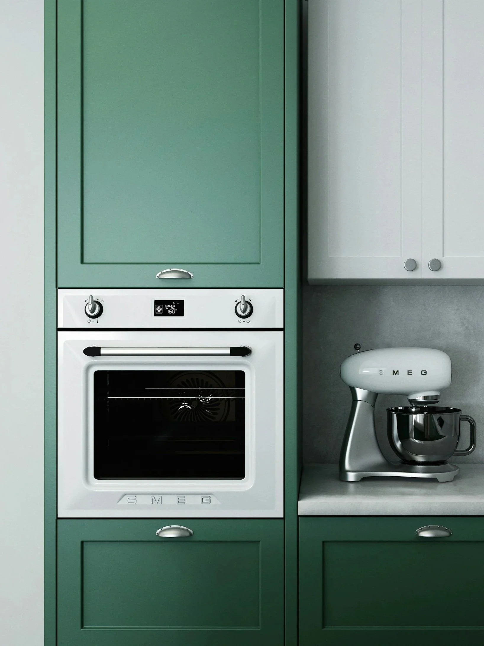 A kitchen with green cabinetry, a built-in oven, and a white stand mixer on a gray countertop.