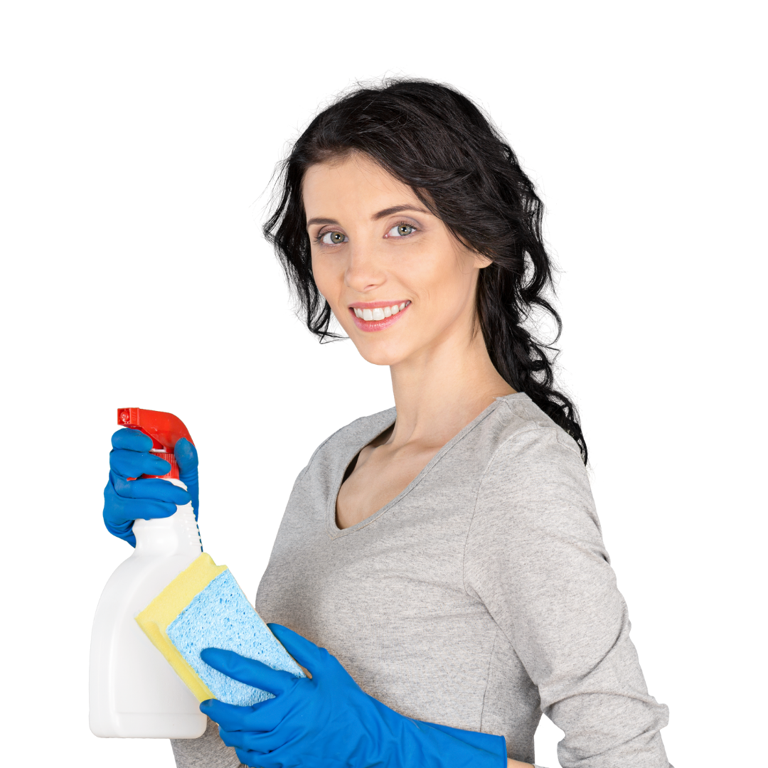 A woman with dark wavy hair smiling, wearing a gray shirt and blue rubber gloves, holding a spray bottle and a cleaning sponge.