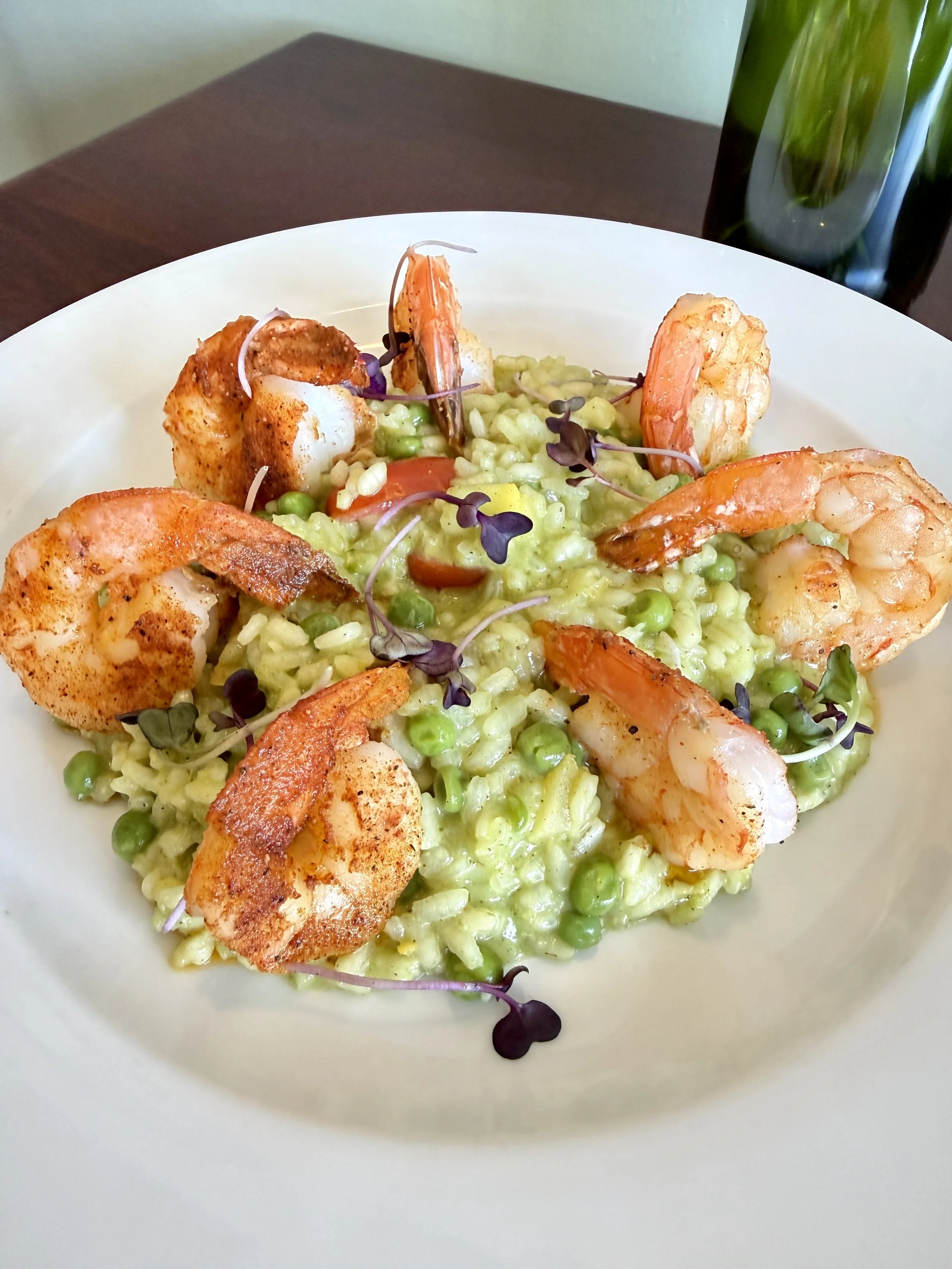 Seared Gulf shrimp over spring pea risotto with microgreens, an Italian dish served at Josephine’s private events