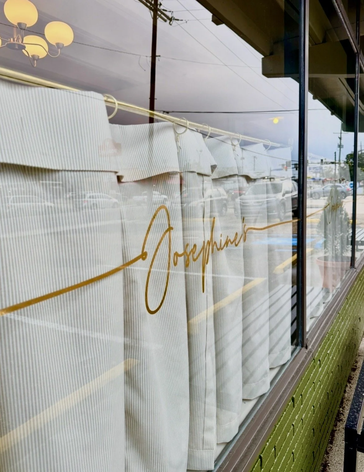 Gold Josephine’s script lettering on the front window of the Italian restaurant on Government Street in Mid City Baton Rouge
