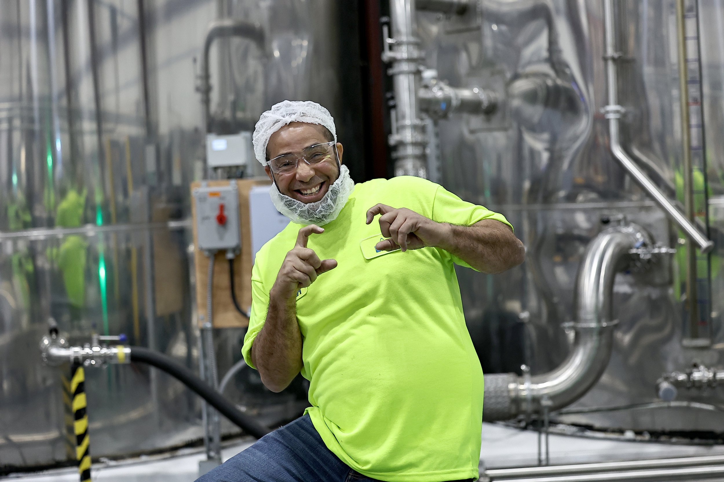 A smiling LMS employee in the plant.