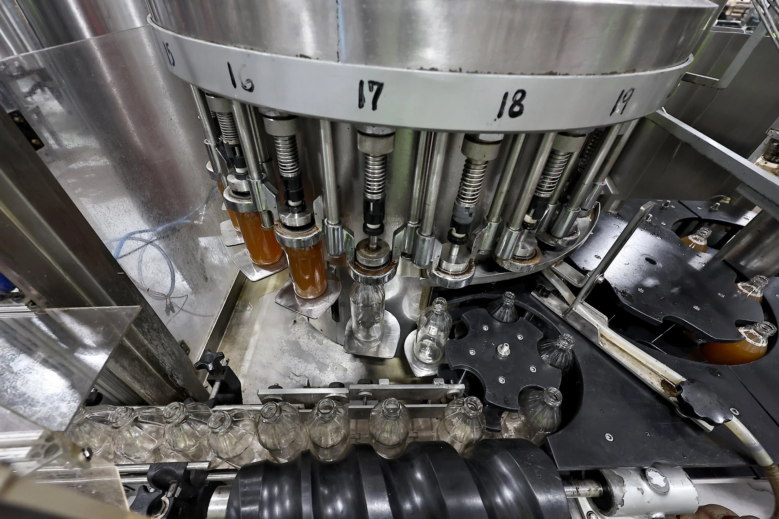 Vinegar Bottles Being Filled