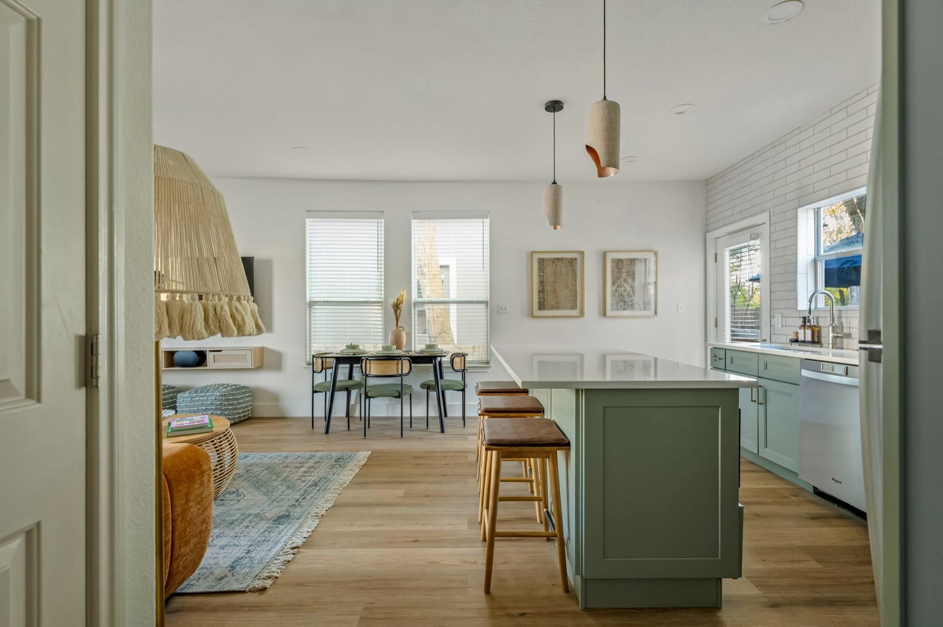 We believe the kitchen is the heart of every home. This once dated and lifeless kitchen now feels like the room everyone gathers in, thanks to a bolder color and a lot more warmth ➡️ swipe to see it before we came onto this project.

#airbnbdesign #a