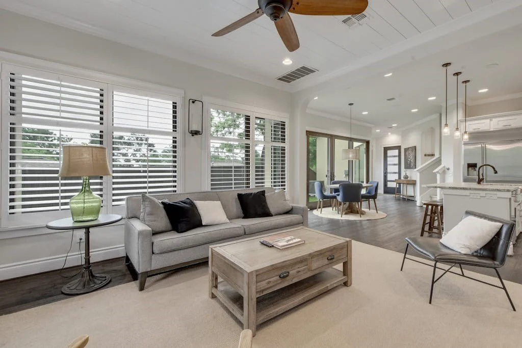 Before image of an unstaged living and dining room in a short-term rental property, shown prior to Airbnb design upgrades, rental property staging, and vacation rental interior design improvements.