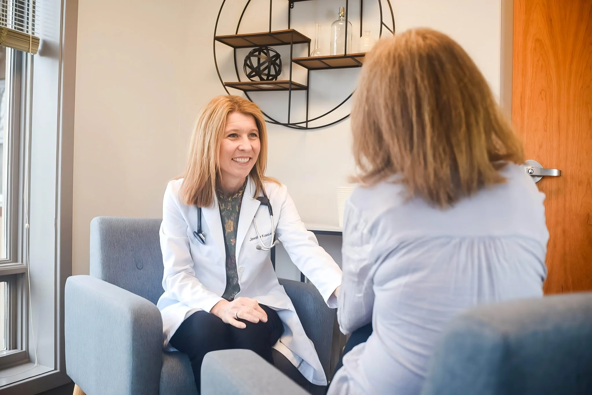 Dr. Jennifer Kostacos talking to a patient in Horsham, PA.