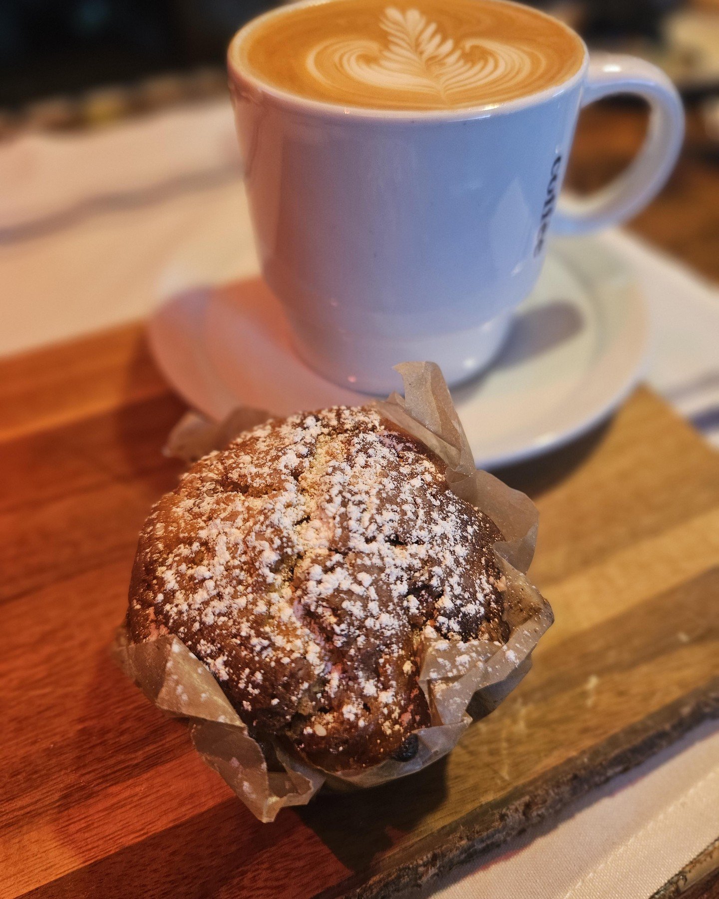 Morning magic ☕️ Our perfectly crafted latte paired with a freshly muffins dusted with love. This is what breakfast dreams are made of. Come experience the Calaveras Coffee Bar difference today.